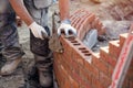 Bricklayer working on a curved wall