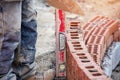 Bricklayer working on a curved wall