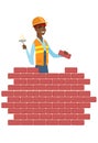 Bricklayer working with spatula and brick.