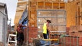 Bricklayers building a wall