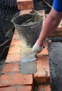 Bricklayers hands in masonry gloves bricklaying new house wall. Bricklaying house wall Royalty Free Stock Photo