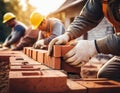 Bricklayers work diligently to construct a Royalty Free Stock Photo