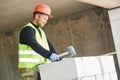 Bricklayer builder working with autoclaved aerated concrete blocks. Walling Royalty Free Stock Photo