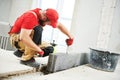 Bricklayer builder working with ceramsite concrete blocks. Walling Royalty Free Stock Photo