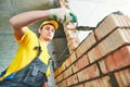 Bricklaying. Construction worker building a brick wall