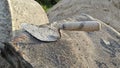 bricklaying trowel tool after at the construction site. Royalty Free Stock Photo