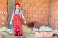 Brickmason working on construction site, worker on building site. Royalty Free Stock Photo