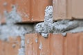 Harden cement uniting two red bricks Royalty Free Stock Photo