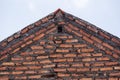 bricks arranged to form a triangle for the roof of the house