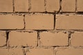 Bricks of orange color close-up, solid wall, textured stone Royalty Free Stock Photo