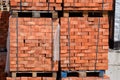 Bricks on pallets. Storage of bricks at construction site