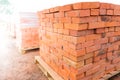 The bricks are stacked on wooden pallets and prepared for sale. Clay brick is an ecological building material. Royalty Free Stock Photo
