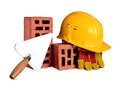 Bricks, trowel and helmet on isolated background