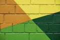 Brick wall is decorated with bright abstract drawings paint closeup. Detail like as graffiti . Fragment for background Royalty Free Stock Photo