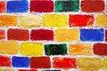 Bricks wall of many colorful painted bricks. Royalty Free Stock Photo