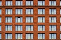 Brickwork facade of a residential building in the loft style. Royalty Free Stock Photo