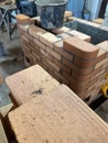 Brickwork of a wood-burning stove Construction of a heating furnace Focus on a stack of bricks in the foreground. Royalty Free Stock Photo