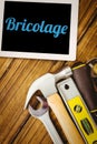 Bricolage against desk with tools Royalty Free Stock Photo
