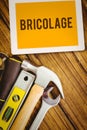 Bricolage against desk with tools Royalty Free Stock Photo