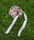 Bridal boquet on grass Royalty Free Stock Photo