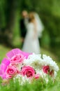 Bridal bouquet on a background of blurred silhouette of a bride