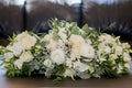 Bridal bouquet. The bride`s bouquet. Beautiful bouquet of white, blue, pink flowers and greenery, decorated with long silk ribbon Royalty Free Stock Photo