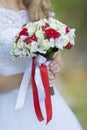 Bridal bouquet in hands of bride