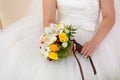 Bridal bouquet in the hands of