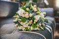 Bridal bouquet lie on a sofa. Wedding acsessories