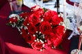 Bridal bouquet of red roses on table Royalty Free Stock Photo