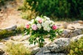 Bridal bouquet of roses and peonis on the rocks. Wedding in Mont Royalty Free Stock Photo