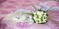 Bridal bouquet with shoes and garter Royalty Free Stock Photo