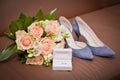 Bridal bouquet, shoes, wedding ring in a box