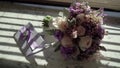 Bridal bouquet and violet invintation