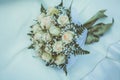 Bridal bouquet on the weddind dress