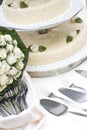 Bridal bouquet and wedding cake Royalty Free Stock Photo
