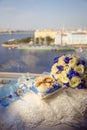 Bridal bouquet, wedding rings on a pillow with shells, bride`s shoes, garter. Wedding details in a marine style. The morning of Royalty Free Stock Photo
