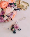 Bridal bouquet and wedding rings table Royalty Free Stock Photo