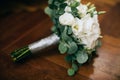 Bridal bouquet of white flowers on wodden background Royalty Free Stock Photo