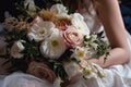 Bridal bouquet of white and pink flowers in the hands of the bride, bride holding a beautiful wedding bouquet close to her chest, Royalty Free Stock Photo