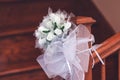 Bridal bouquet of white roses in bright colors on the stair rail Royalty Free Stock Photo