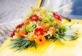 Bridal bouquet on a yellow wedding car Royalty Free Stock Photo