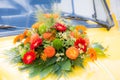 Bridal bouquet on a yellow wedding car Royalty Free Stock Photo