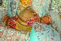 Bridal clutch is in hands of a bride with jewelleries