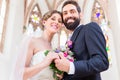 Bridal couple in church having wedding Royalty Free Stock Photo