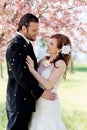 Bridal Couple Showered by Cherry Blossom Petals