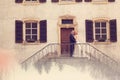 Bridal couple on stairs of their house