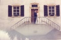 Bridal couple on stairs of their house