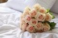 Bridal elegance flowers arranged on a pristine white bed