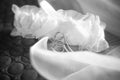 bridal garter for stockings with two silver hearts. Black and white monochrome picture. Wedding clothing element Royalty Free Stock Photo